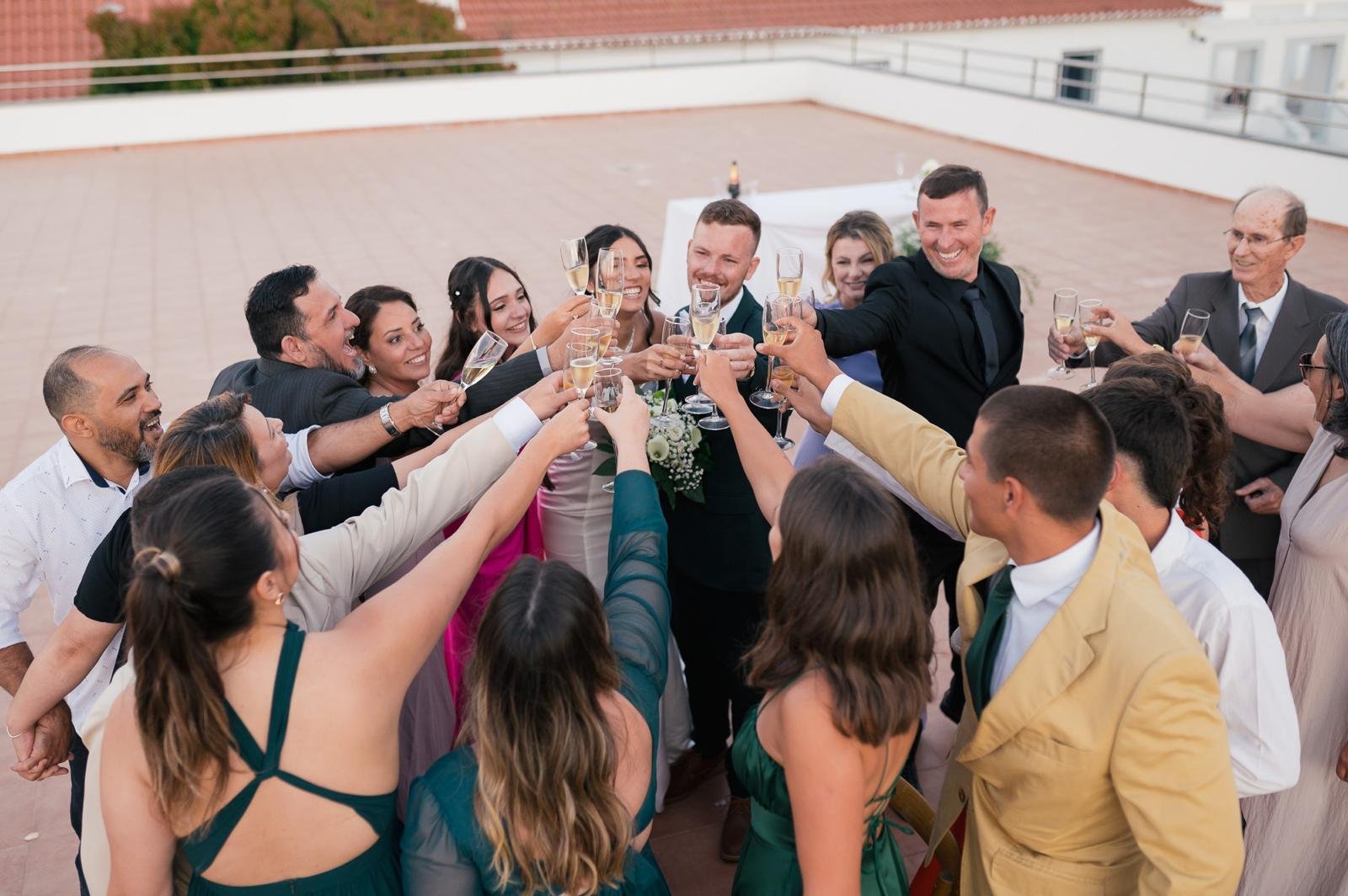 Guests raising a toast at cocktail hour at Quinta do Boiro