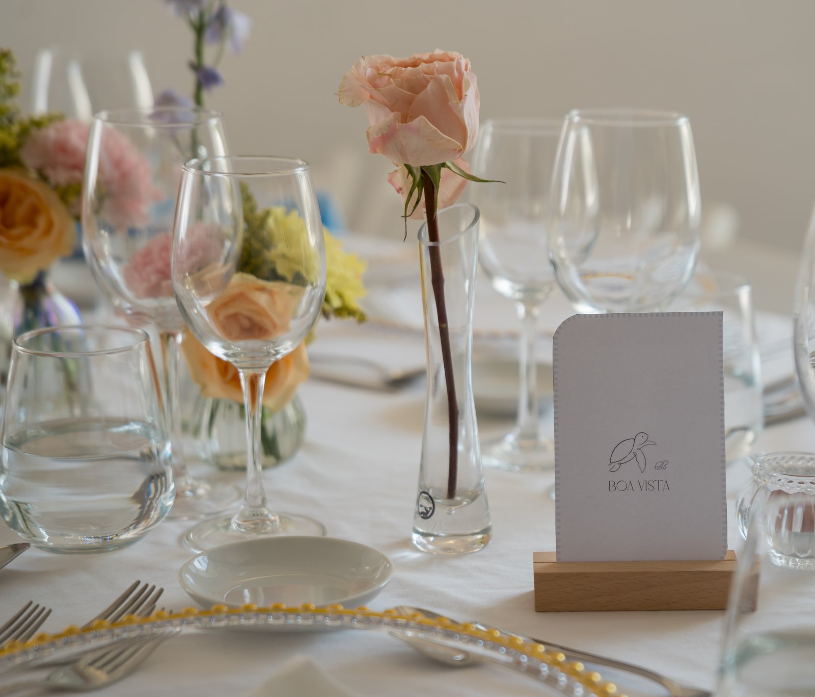 A place setting and menu card at a wedding dinner at Quinta do Boiro